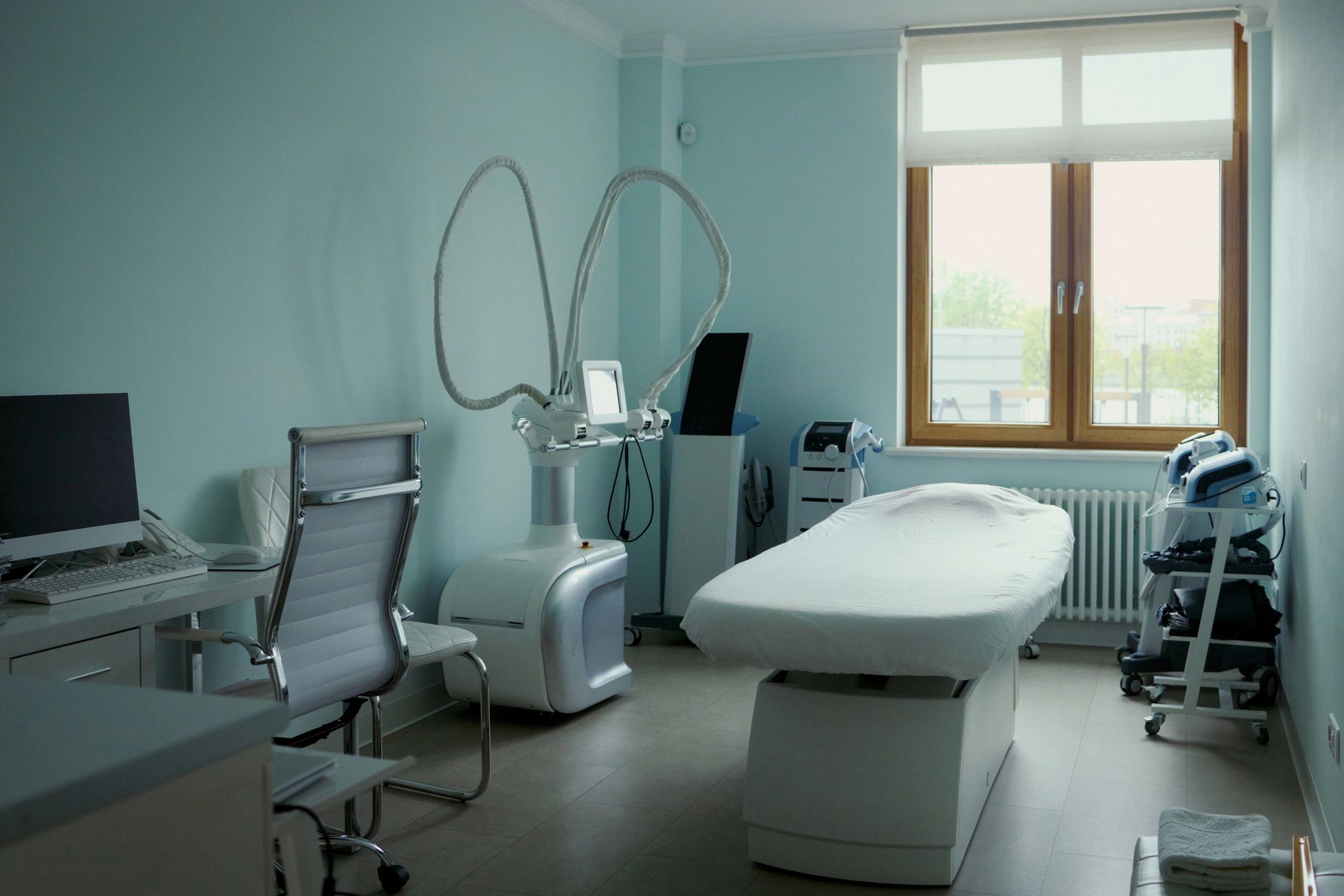 Modern dermatology clinic treatment room